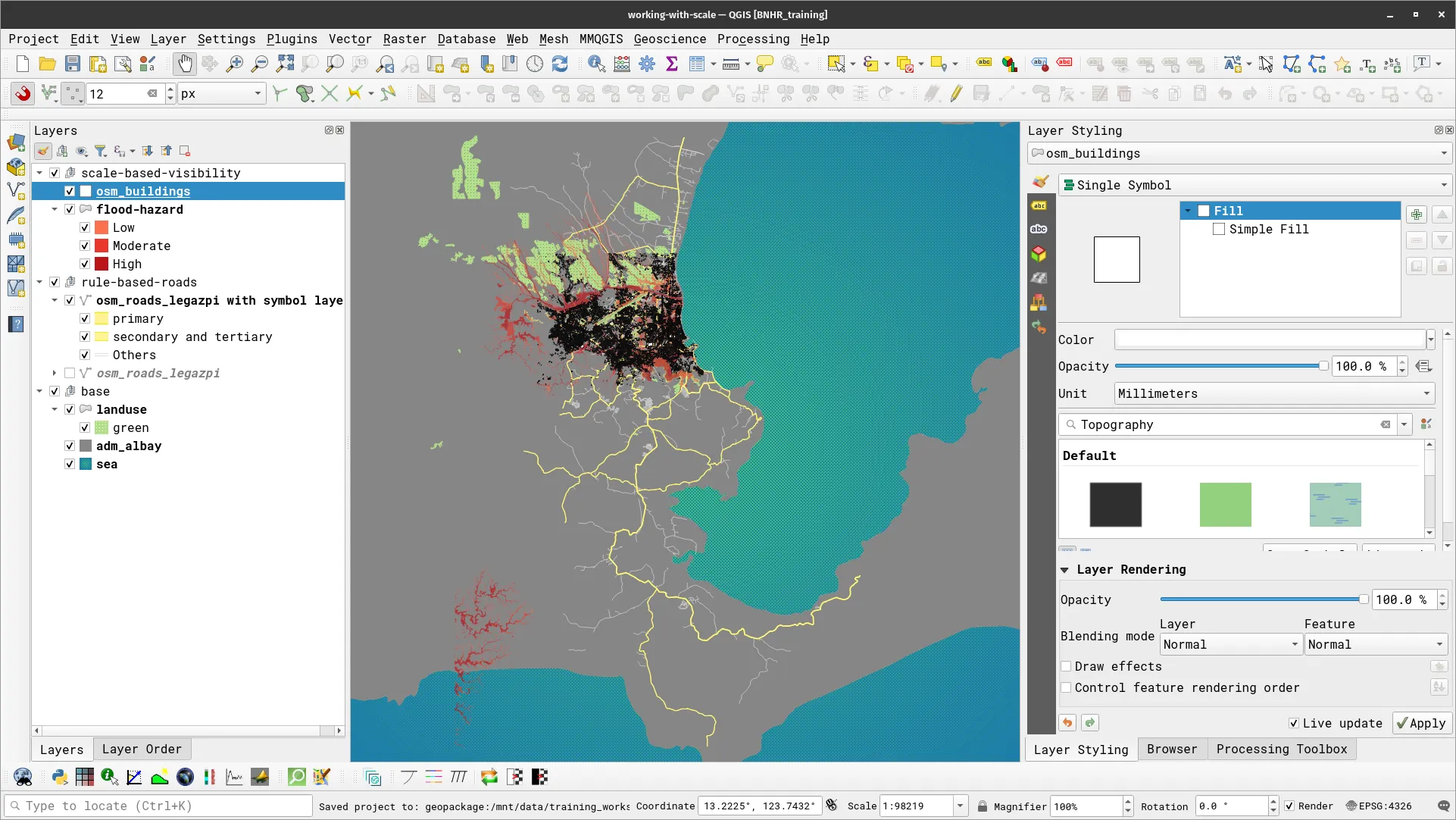 Roads, buildings, and flood hazard layers loaded in QGIS