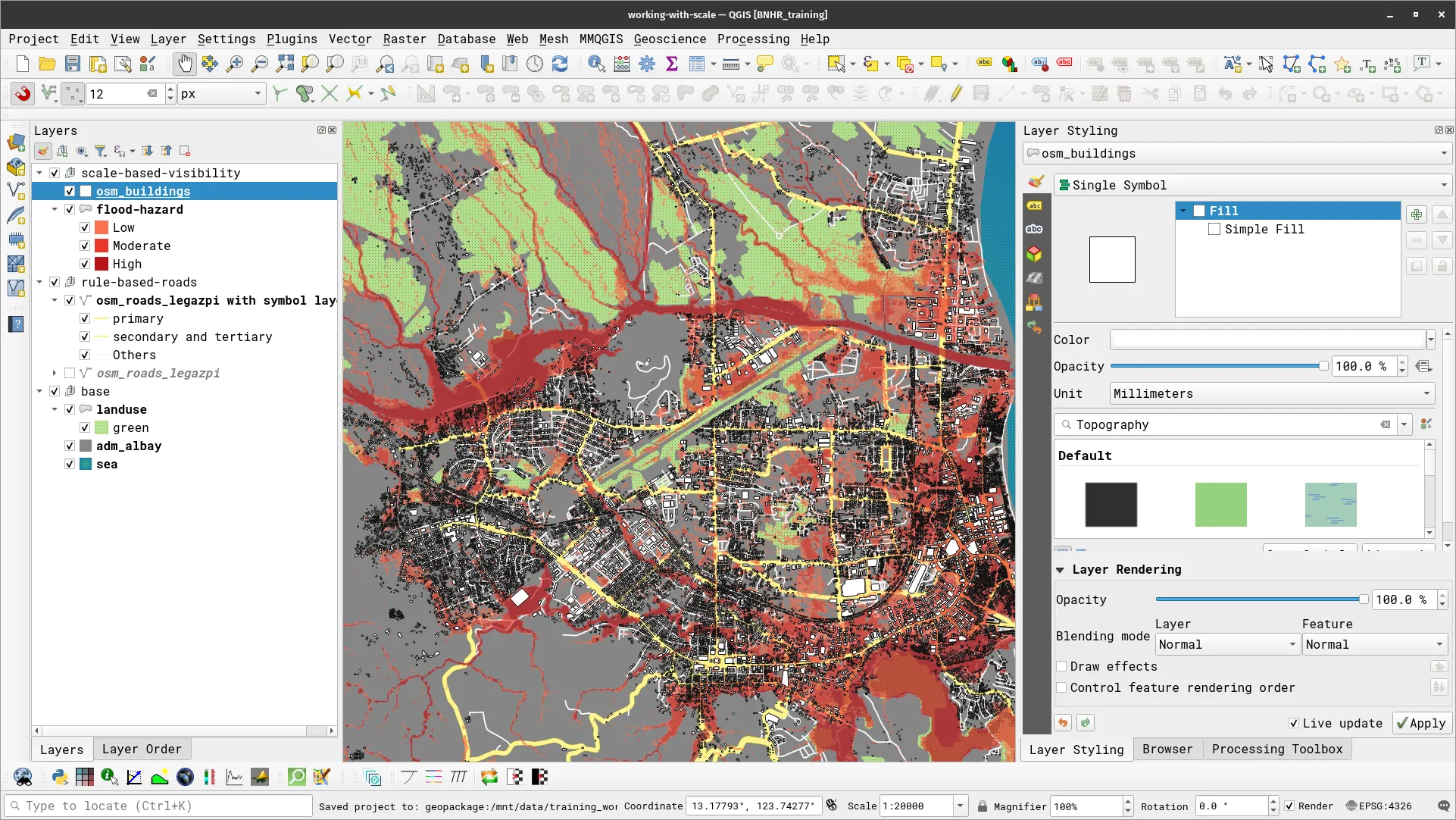 At 1:20,000 scale, the osm_buildings layer is now visible on the map canvas
